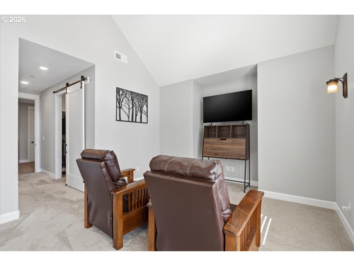 4026 Northwest 75th Avenue, Unit 70 Camas, WA 98607 - Photo 17 of 47 a living room with furniture and a flat screen tv