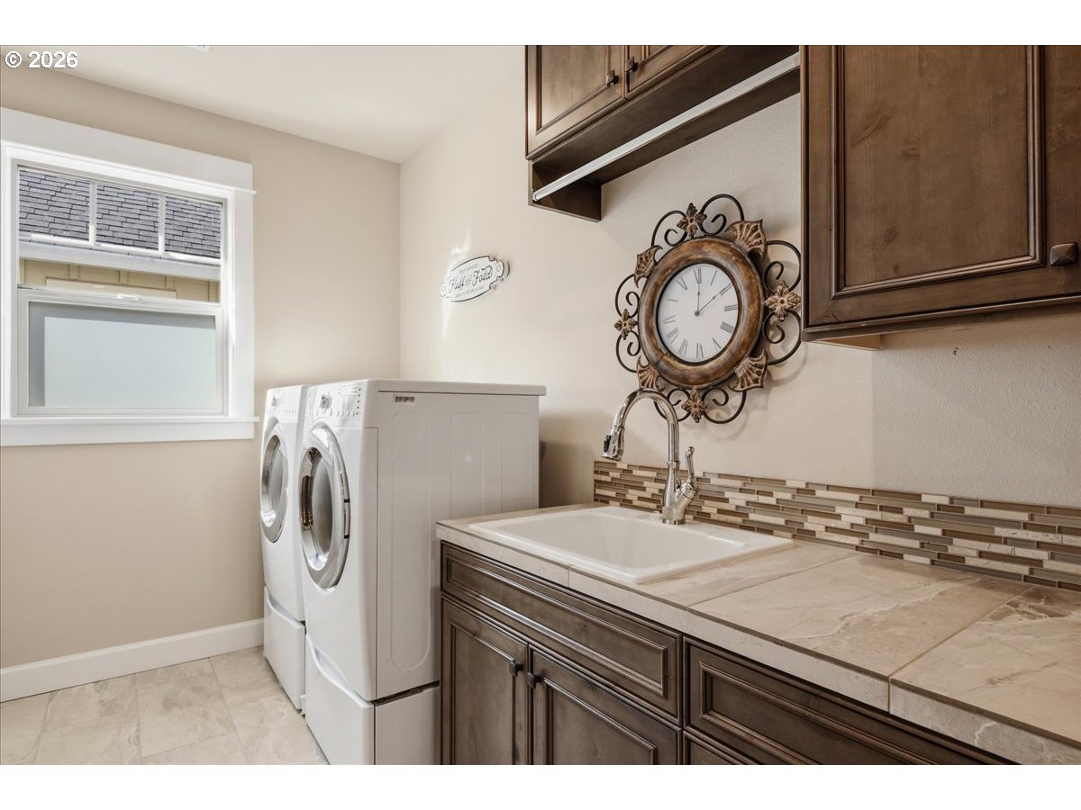 4026 Northwest 75th Avenue, Unit 70 Camas, WA 98607 - Photo 23 of 47 a kitchen with a sink and a refrigerator