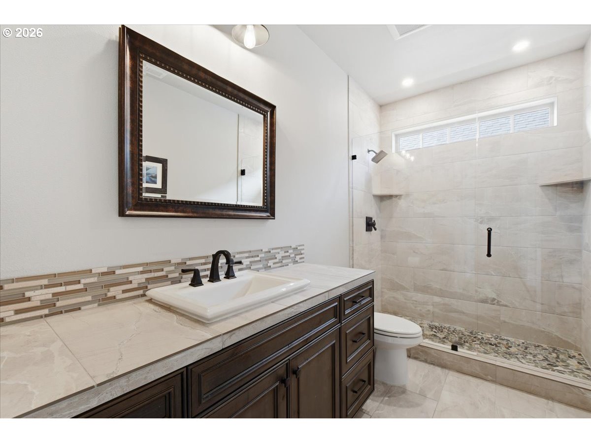 4026 Northwest 75th Avenue, Unit 70 Camas, WA 98607 - Photo 25 of 47 a bathroom with a sink mirror and a toilet