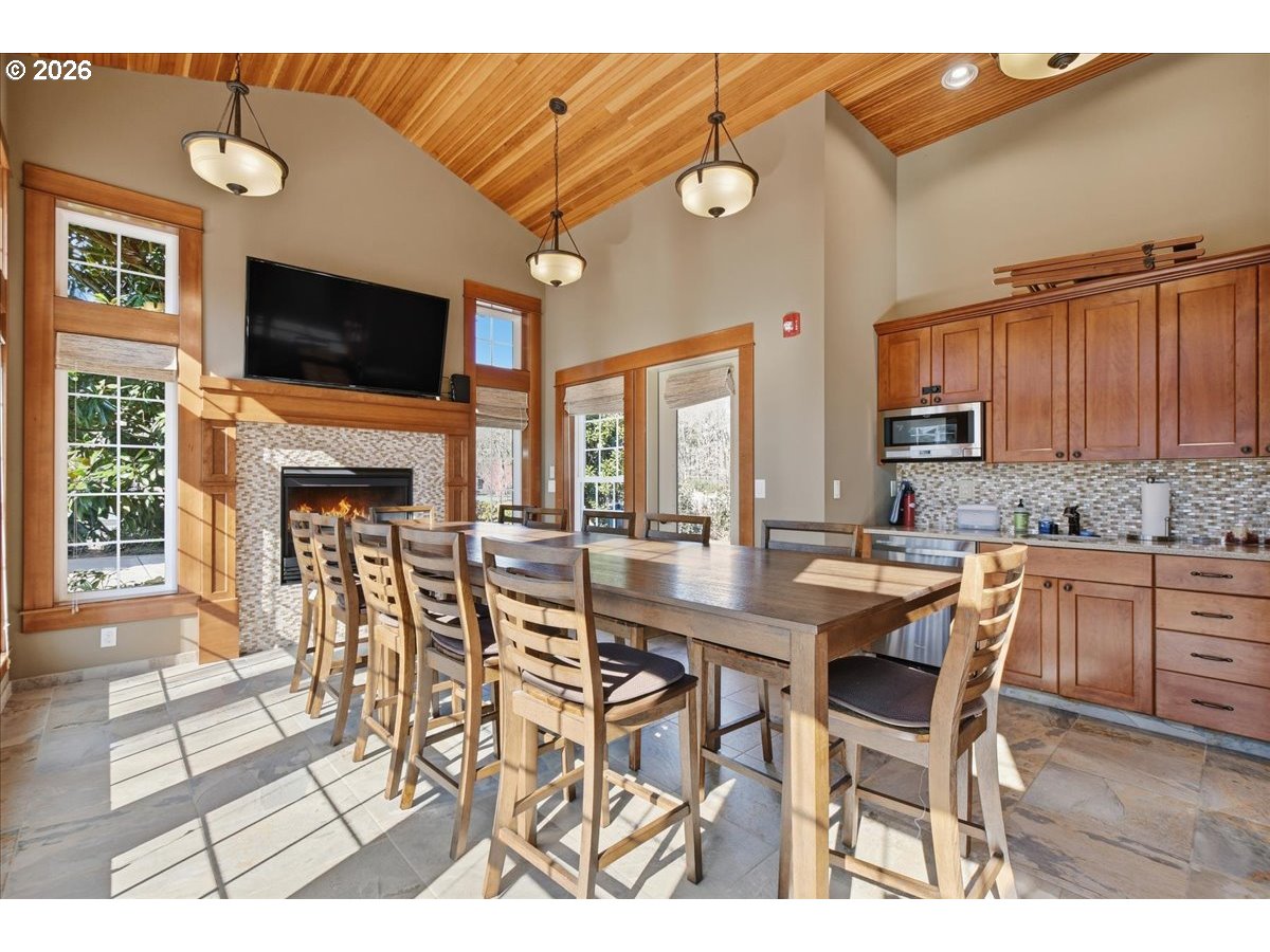 4026 Northwest 75th Avenue, Unit 70 Camas, WA 98607 - Photo 34 of 47 a view of a dining room with furniture wooden floor and a fireplace
