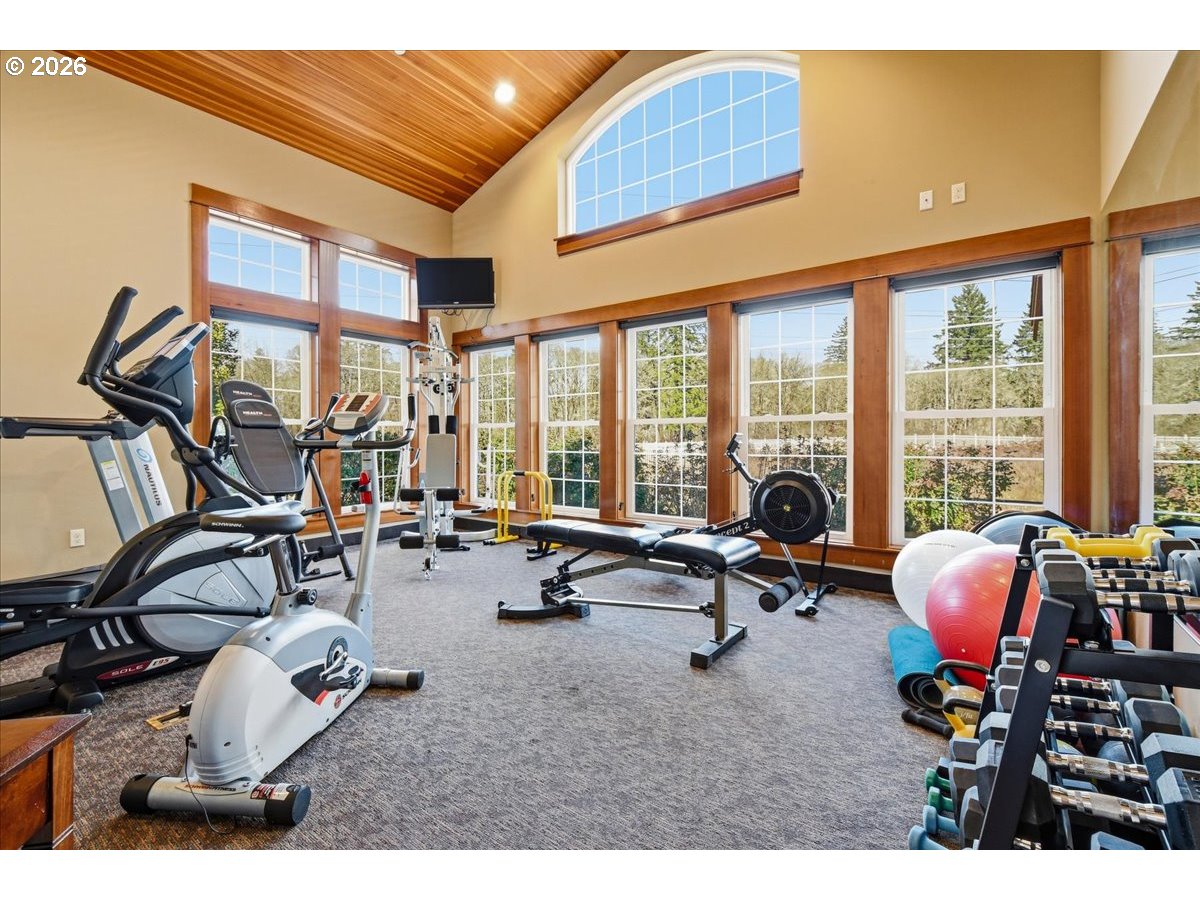 4026 Northwest 75th Avenue, Unit 70 Camas, WA 98607 - Photo 35 of 47 a living room filled with furniture and floor to ceiling windows