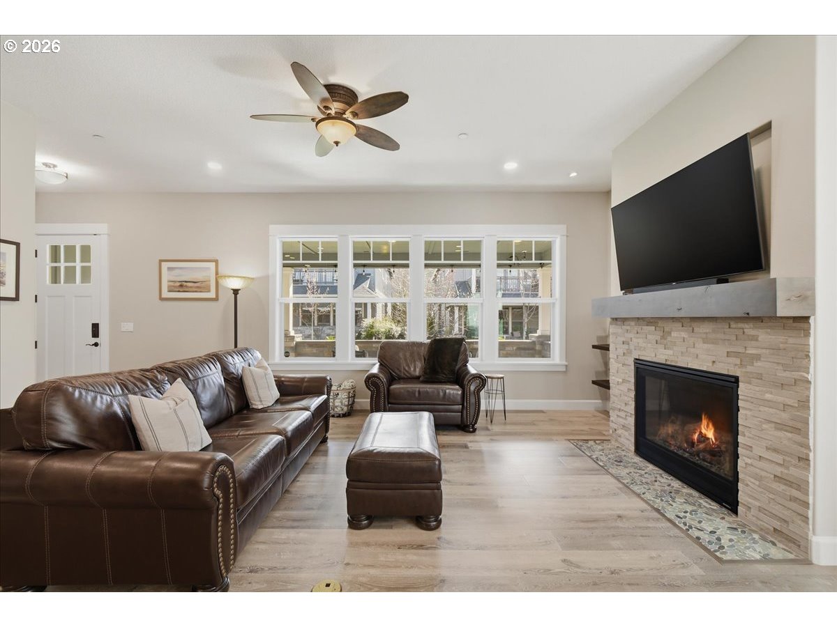 4026 Northwest 75th Avenue, Unit 70 Camas, WA 98607 - Photo 6 of 47 a living room with furniture a fireplace and a flat screen tv