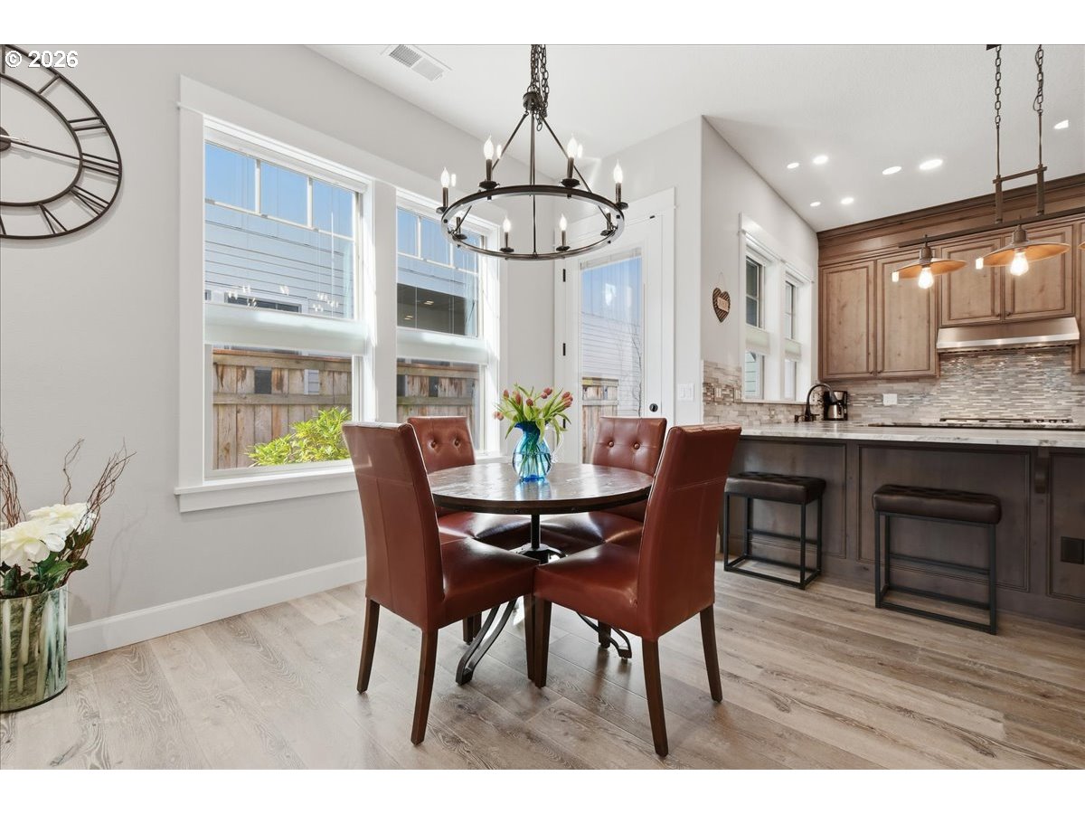 4026 Northwest 75th Avenue, Unit 70 Camas, WA 98607 - Photo 8 of 47 a view of a dining room with furniture window and wooden floor