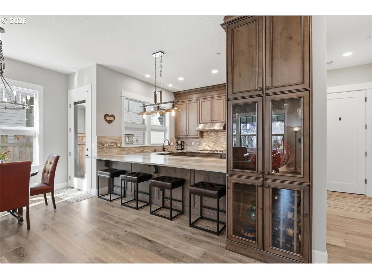 4026 Northwest 75th Avenue, Unit 70 Camas, WA 98607 - Photo 9 of 47 a open kitchen with granite countertop a dining table chairs and wooden floor