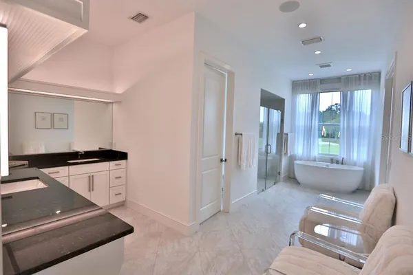 a bathroom with a double vanity sink and mirror