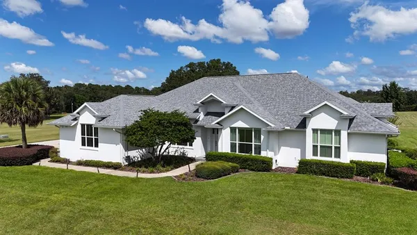 a view of a lake with a yard