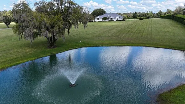 a view of a lake with a yard