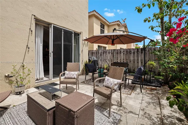 a outdoor space with patio couches and a potted plant