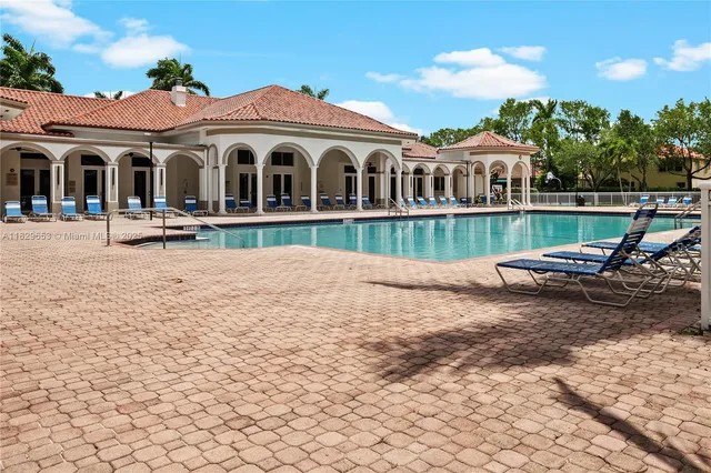 a view of a lake with houses in the back