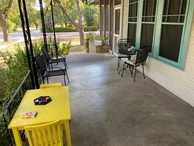 a view of an outdoor space with porch and patio