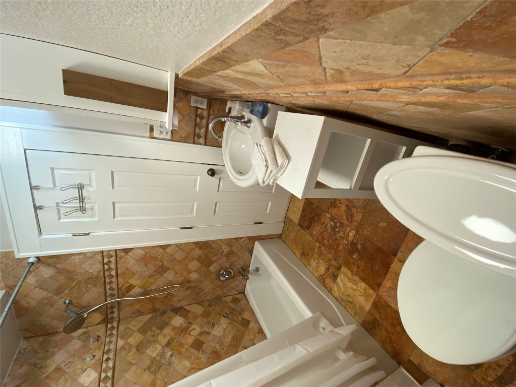 3101 Wheeler Street Austin, TX 78705 - Photo 5 of 16 a bathroom with a sink a toilet and shower