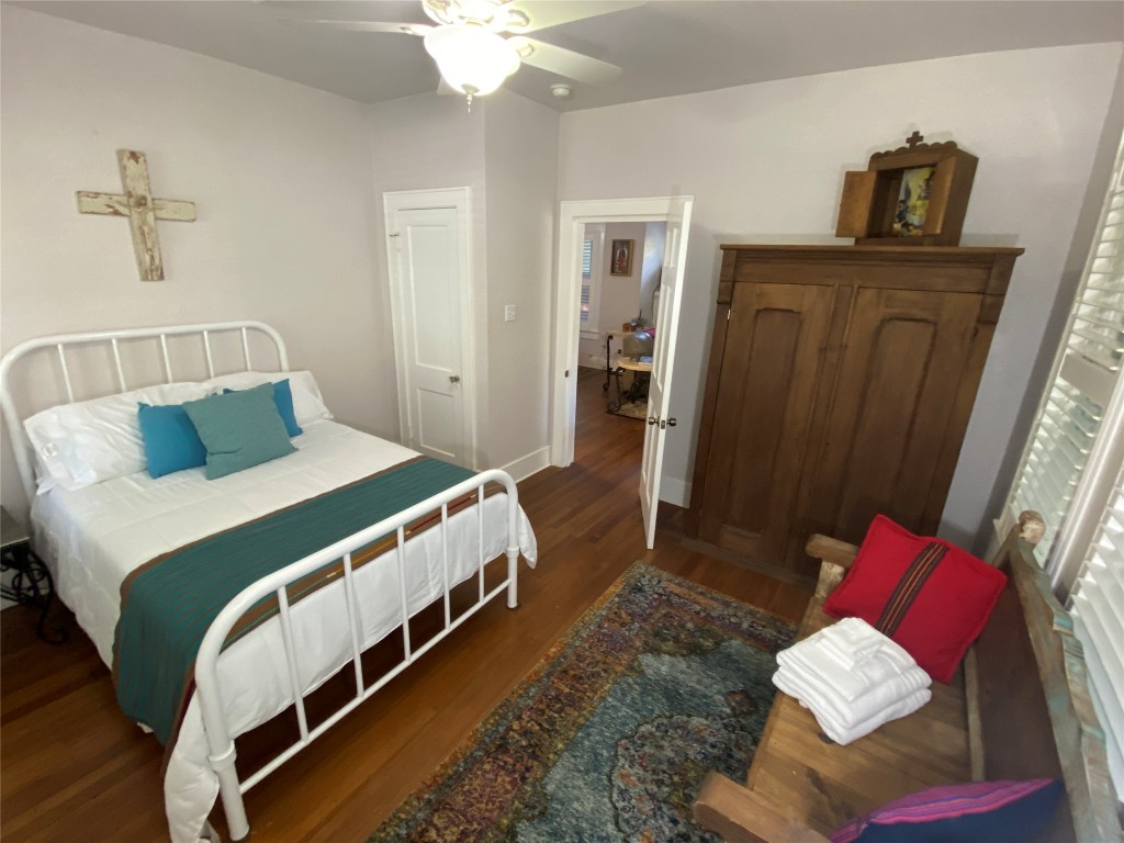 3101 Wheeler Street Austin, TX 78705 - Photo 6 of 16 a bedroom with bed and wooden floor