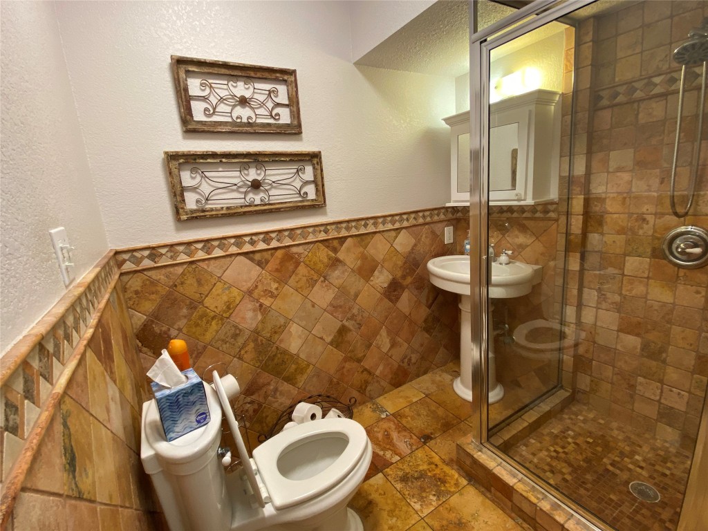 3101 Wheeler Street Austin, TX 78705 - Photo 8 of 16 a bathroom with a toilet and a shower