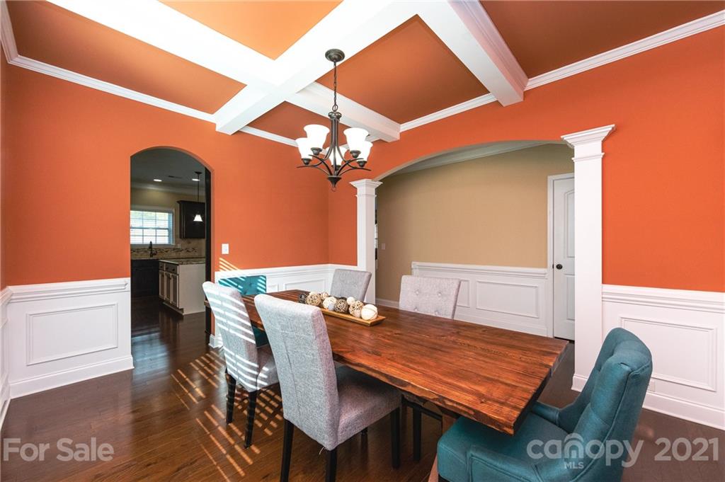 281 Annatto Way Tega Cay, SC 29708 - Photo 19 of 48 a view of a dining room with furniture and wooden floor