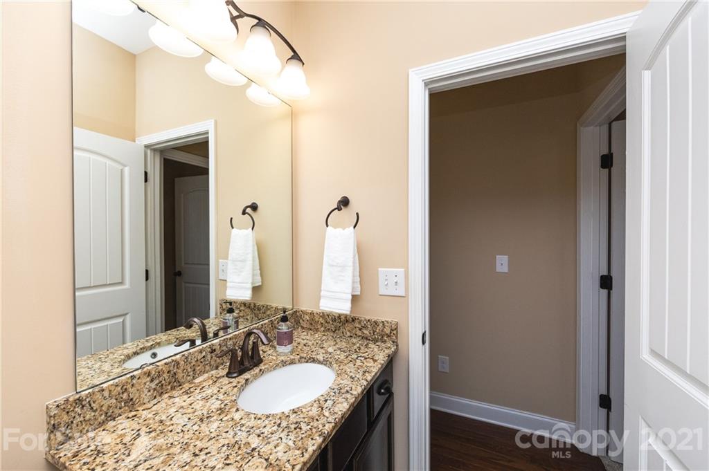 281 Annatto Way Tega Cay, SC 29708 - Photo 22 of 48 a bathroom with a granite countertop sink and a mirror