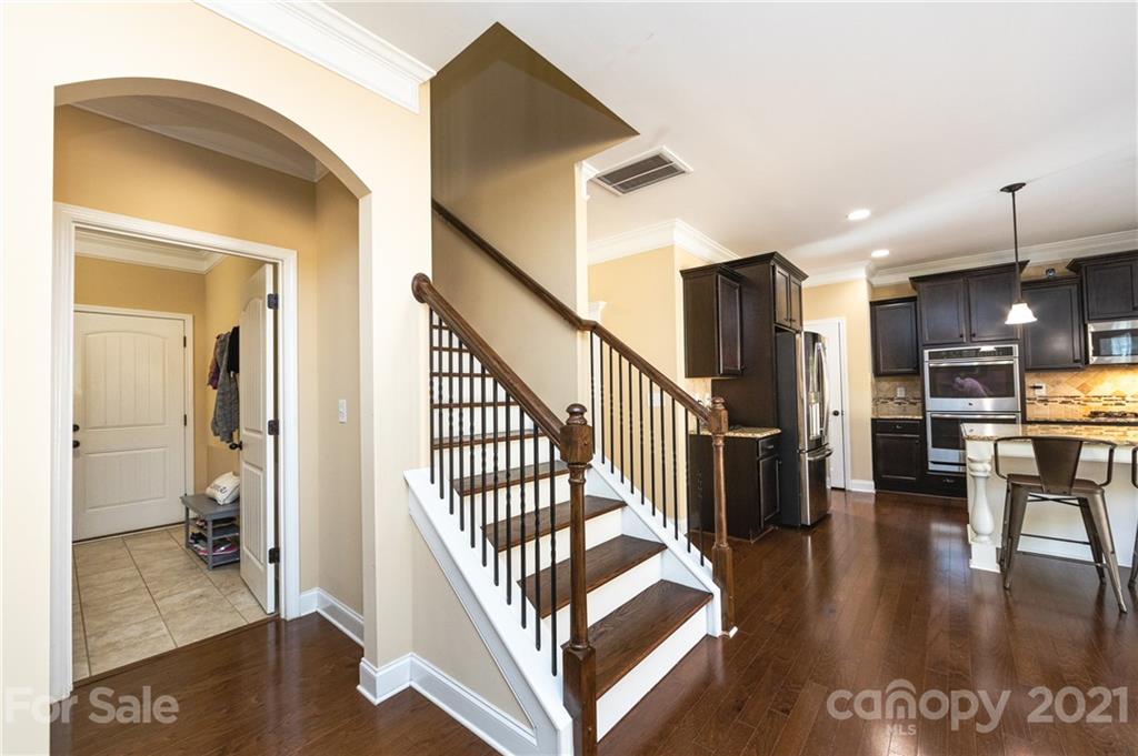 281 Annatto Way Tega Cay, SC 29708 - Photo 23 of 48 a view of a hallway view with living room and dining room
