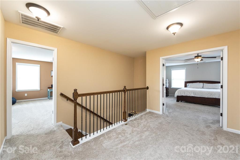281 Annatto Way Tega Cay, SC 29708 - Photo 25 of 48 a view of a bedroom with a bed and a window