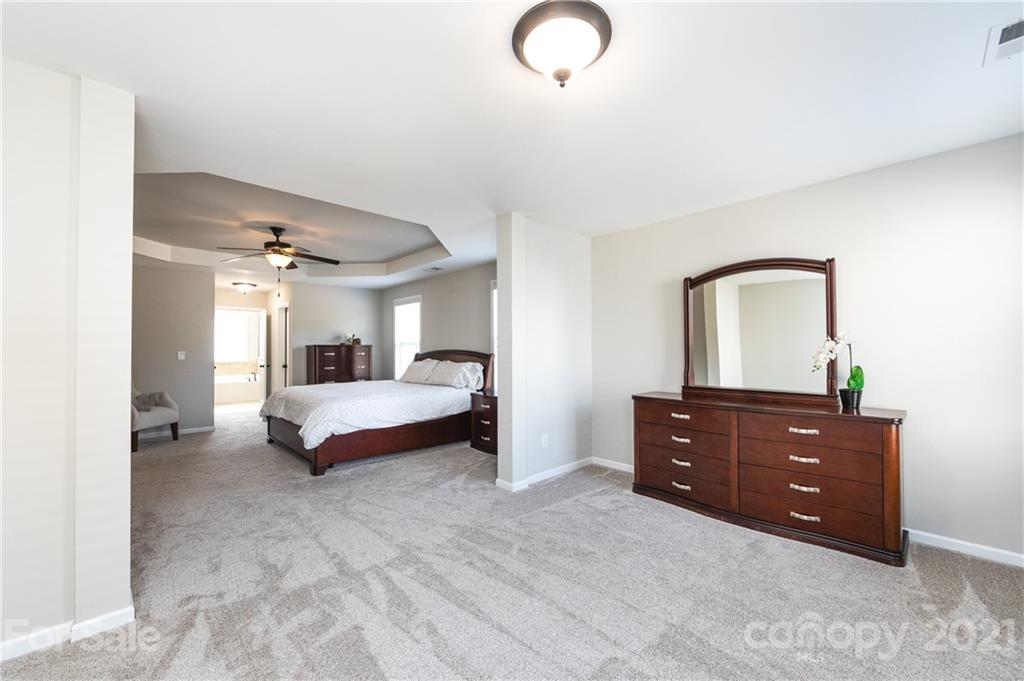 281 Annatto Way Tega Cay, SC 29708 - Photo 28 of 48 a bedroom with a bed and window
