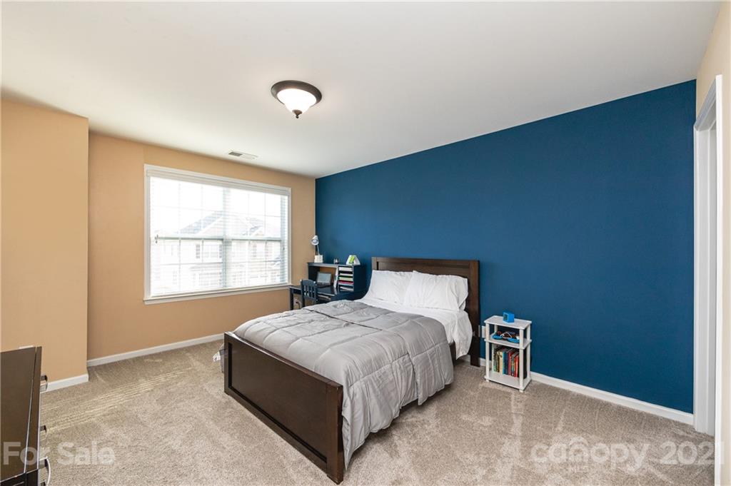 281 Annatto Way Tega Cay, SC 29708 - Photo 36 of 48 a bedroom with a bed and a window