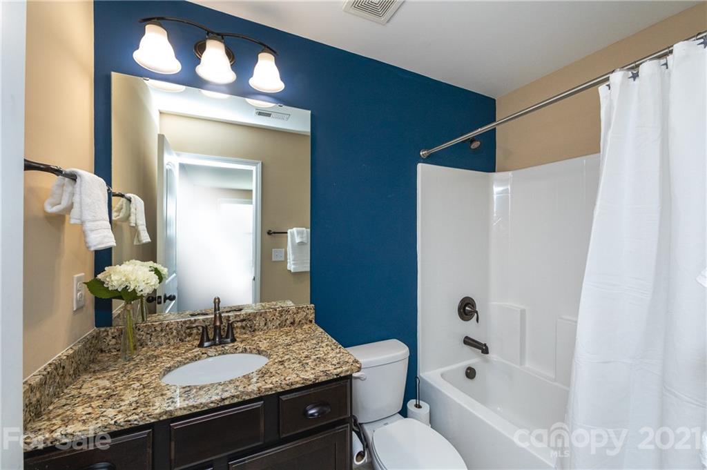 281 Annatto Way Tega Cay, SC 29708 - Photo 38 of 48 a bathroom with a granite countertop sink and a mirror