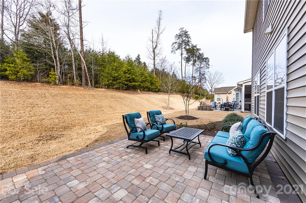 281 Annatto Way Tega Cay, SC 29708 - Photo 42 of 48 a backyard of a house with table and chairs