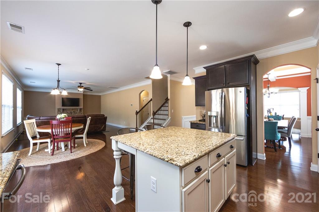 281 Annatto Way Tega Cay, SC 29708 - Photo 8 of 48 a kitchen with a table and chairs