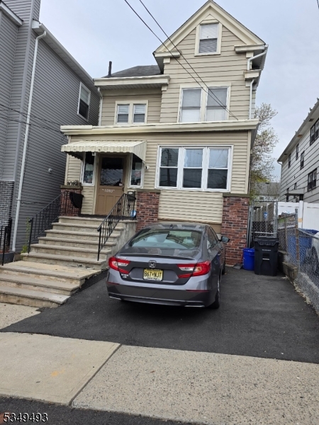 a car parked in front of a house