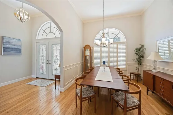 a view of a livingroom with furniture window and wooden floor