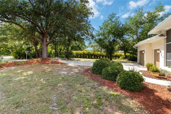 a view of backyard with green space