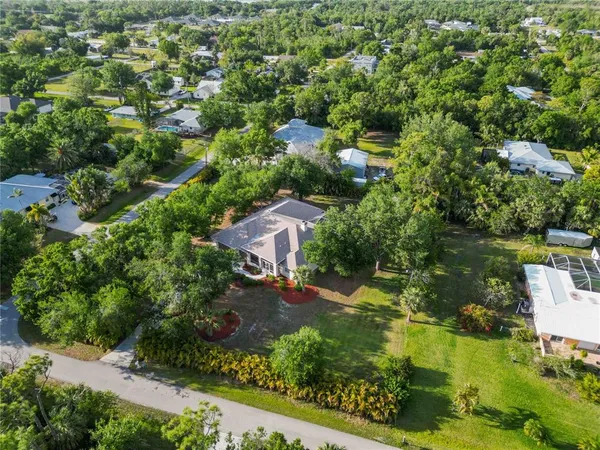 an aerial view of residential house with outdoor space and lake view