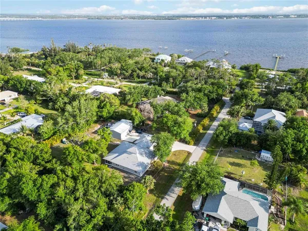 an aerial view of a house with a yard