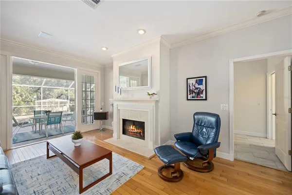a living room with furniture fireplace and window