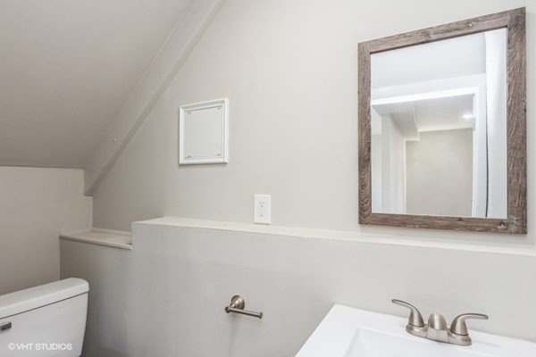170-180 America Street Fall River, MA 02721 - Photo 12 of 40 a bathroom with a toilet sink and mirror