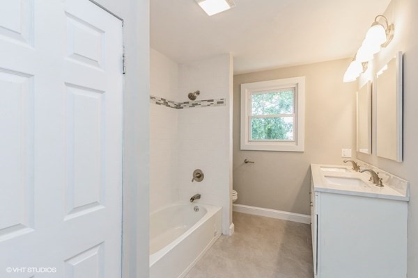 170-180 America Street Fall River, MA 02721 - Photo 13 of 40 a bathroom with a tub sink and mirror