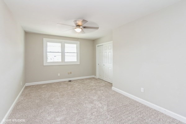 170-180 America Street Fall River, MA 02721 - Photo 14 of 40 an empty room with windows and fan