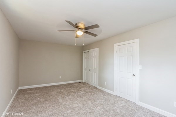 170-180 America Street Fall River, MA 02721 - Photo 20 of 40 an empty room with a window and a fan