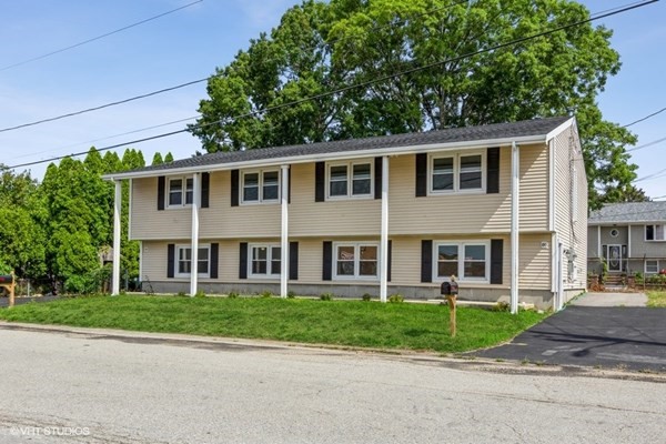 170-180 America Street Fall River, MA 02721 - Photo 2 of 40 a front view of a house with a garden