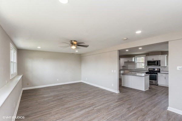 170-180 America Street Fall River, MA 02721 - Photo 21 of 40 a view of a kitchen with a sink and a stove top oven