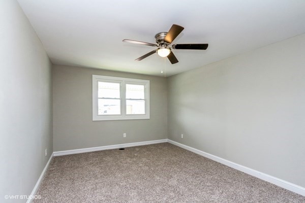 170-180 America Street Fall River, MA 02721 - Photo 35 of 40 an empty room with a window and a fan