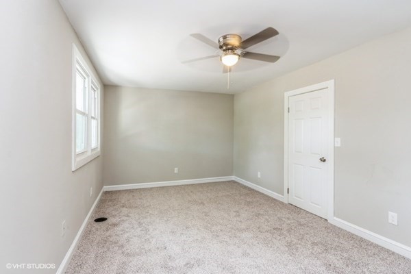 170-180 America Street Fall River, MA 02721 - Photo 37 of 40 an empty room with windows and fan