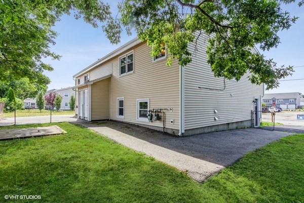 170-180 America Street Fall River, MA 02721 - Photo 39 of 40 a view of a house with a yard