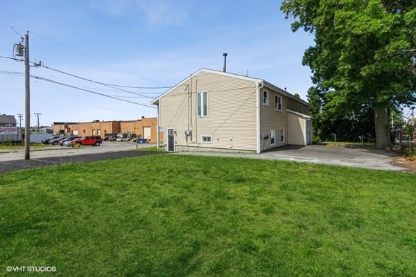 170-180 America Street Fall River, MA 02721 - Photo 40 of 40 a view of a white house with a big yard and large trees