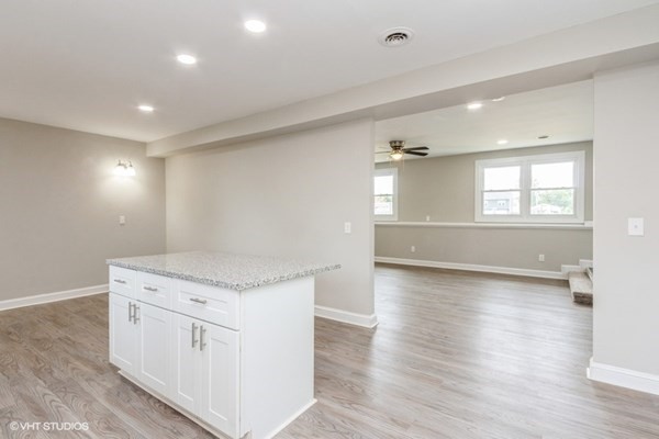 170-180 America Street Fall River, MA 02721 - Photo 9 of 40 a view of a kitchen cabinets and wooden floor