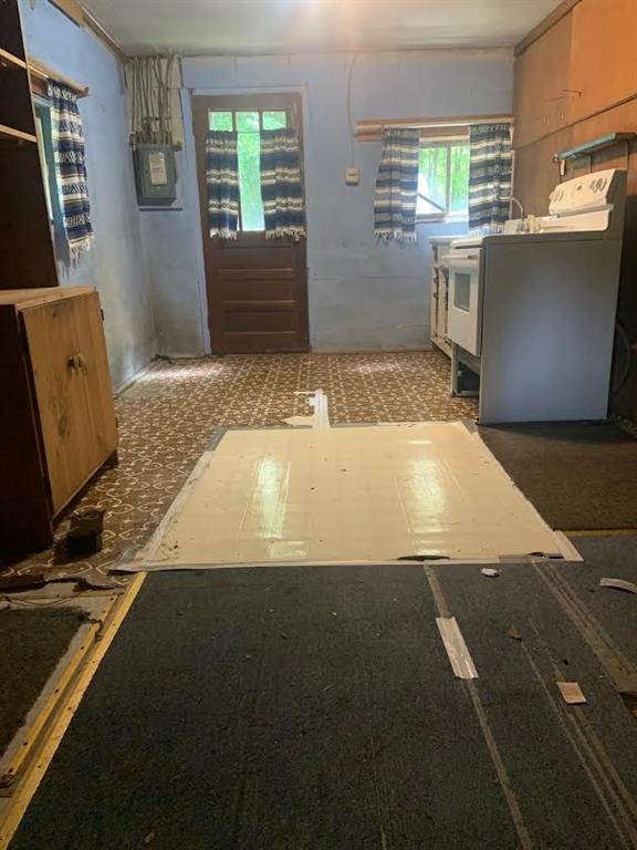 222 Chipmunk Road Evans City, PA 16033 - Photo 21 of 33 a view of a kitchen with fridge and window
