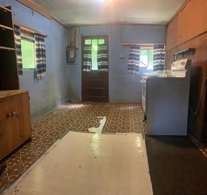 222 Chipmunk Road Evans City, PA 16033 - Photo 22 of 33 a view of hallway with window and refrigerator