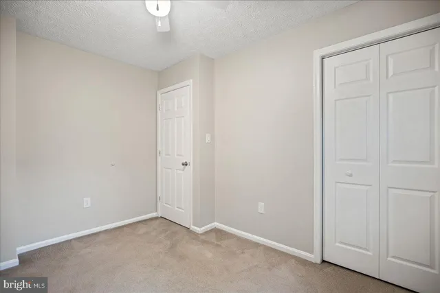 a view of an empty room and entryway