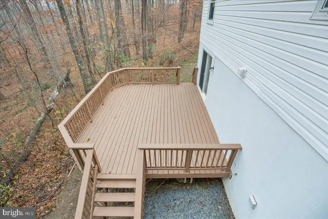 a view of deck with wooden floor and fence