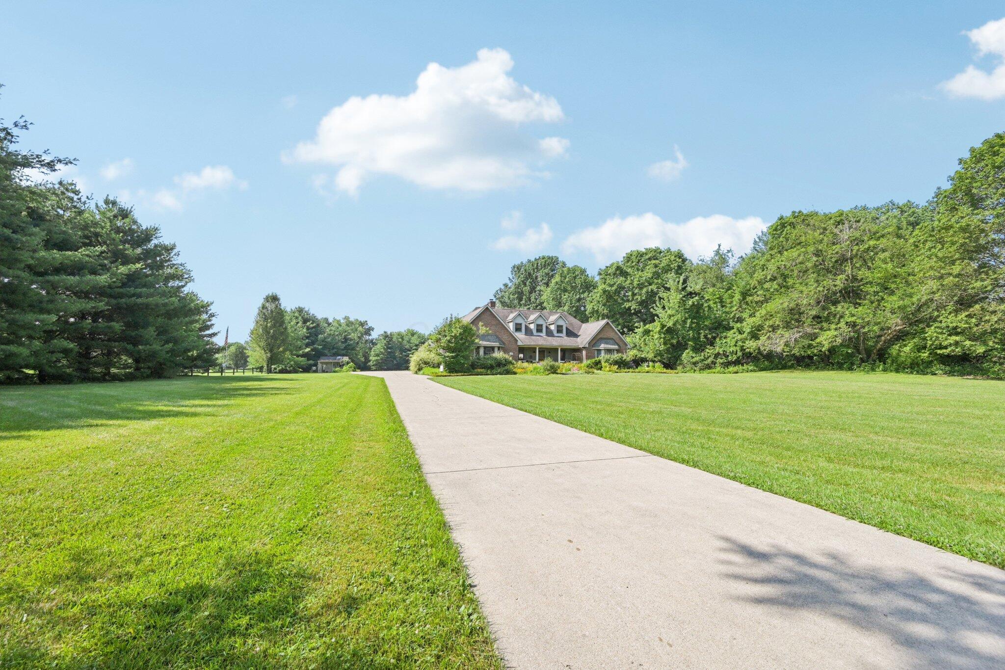 7700 Plumb Road Galena, OH 43021 - Photo 23 of 94 Enjoy the long, scenic approach to the home—set far off the road for ultimate privacy and peaceful country living.