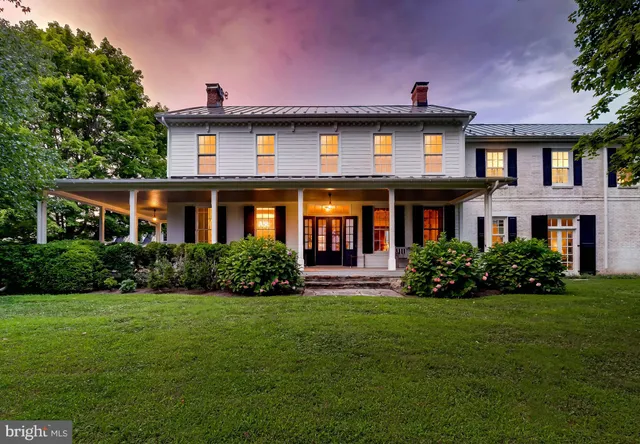 a view of a lake with houses in the back