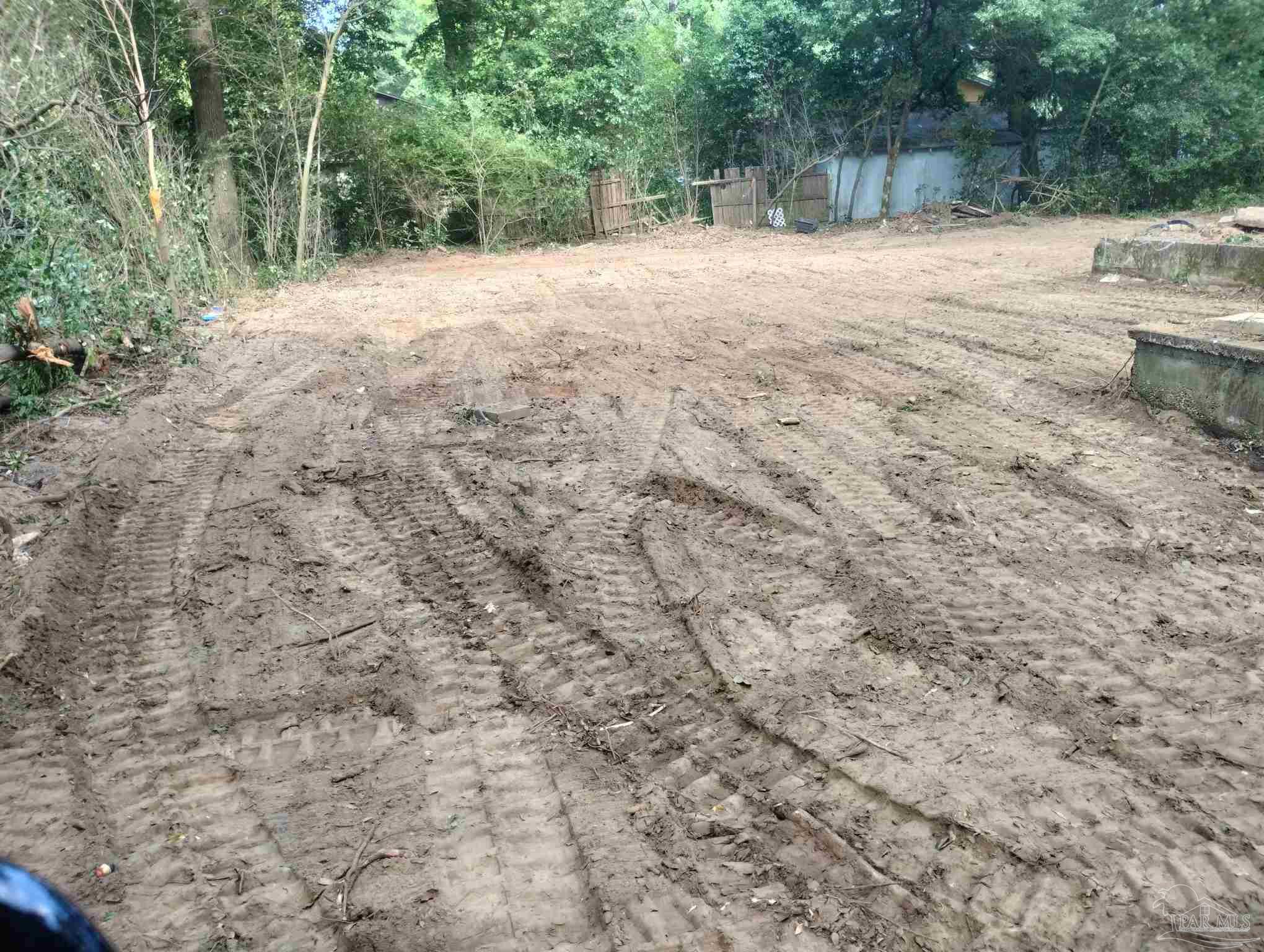 0 North Kenmore Road Pensacola, FL 32503 - Photo 5 of 9 a view of dirt yard with large trees